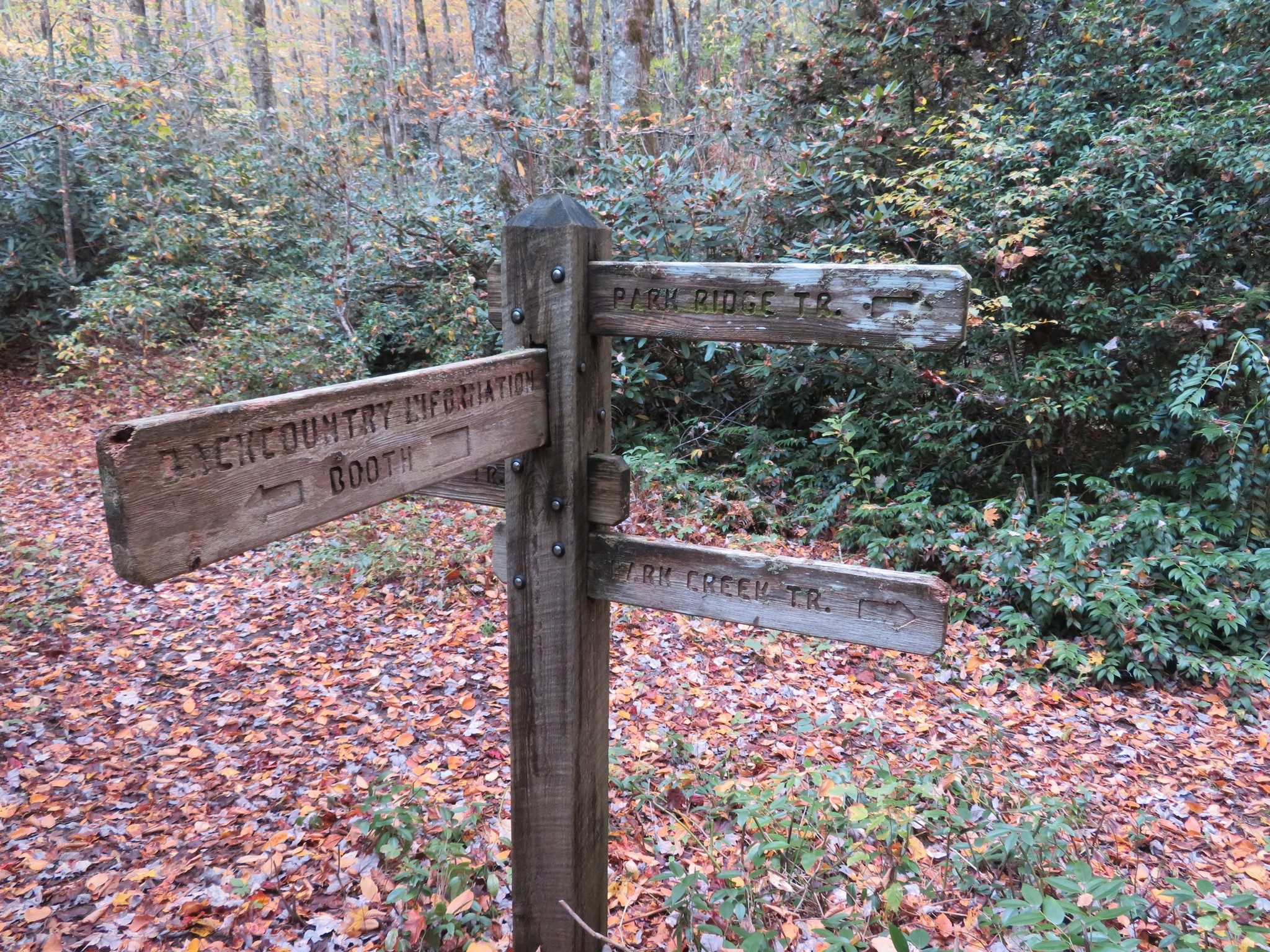 Another trail direction sign intersection of several trails