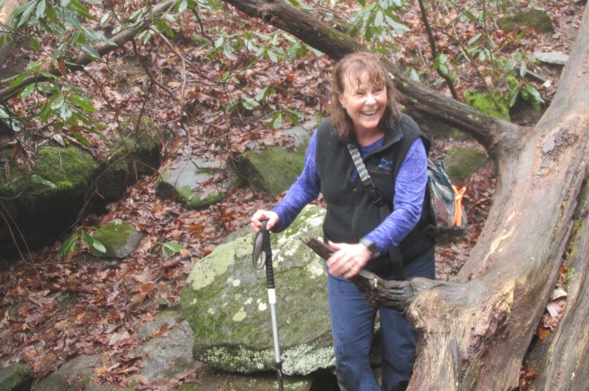 Renée a bit wet after slipping while crossing the falls, but still smiling!
