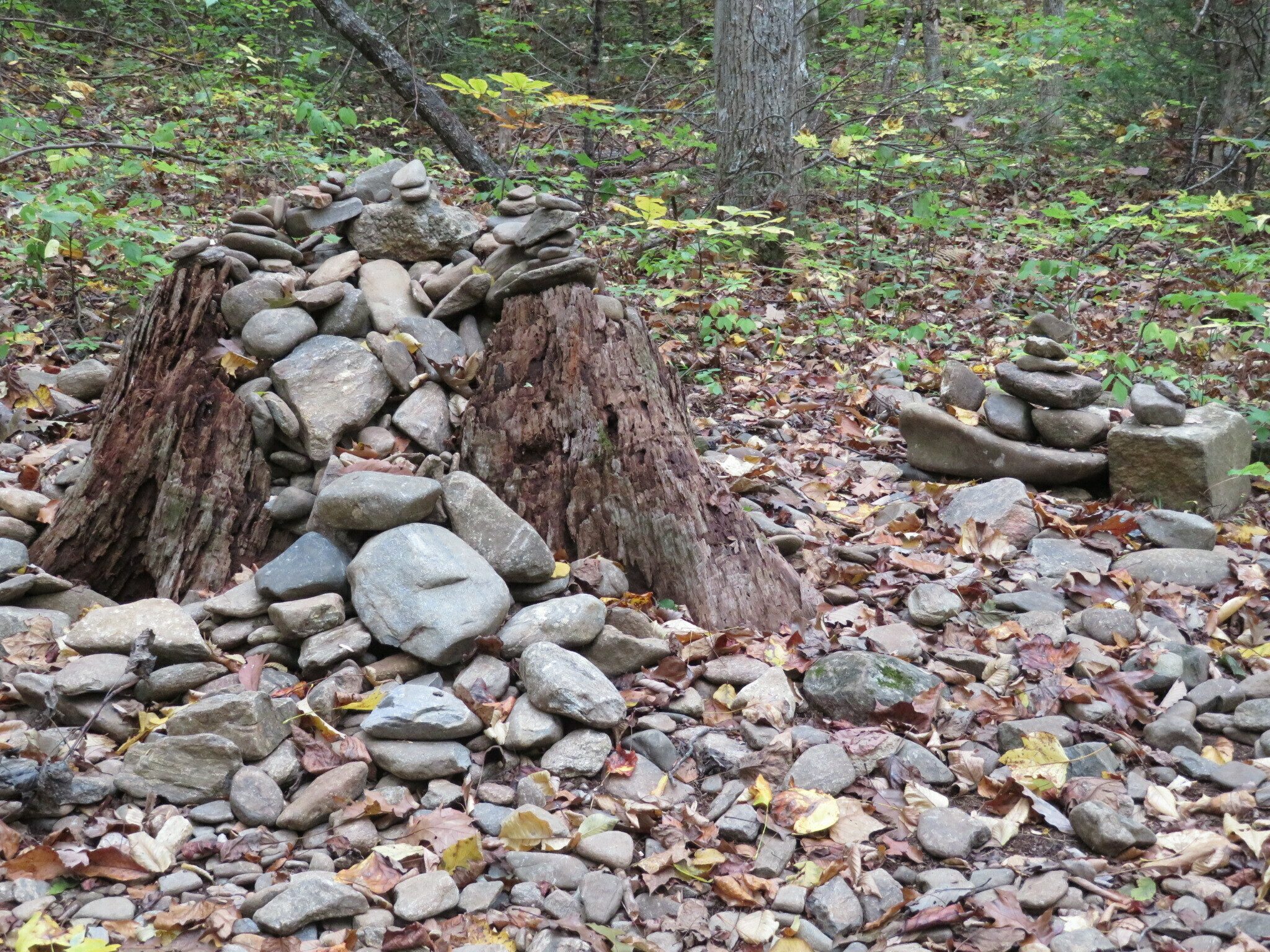 Remnants of rock cairns seen along this trail.  Scientists say, "Quit destroying the habitat of many insects and mammals!"