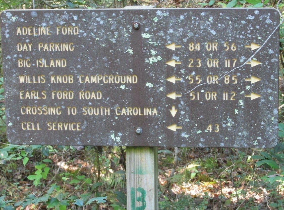 Lots of destinations from this trail sign near Adeline Ford.