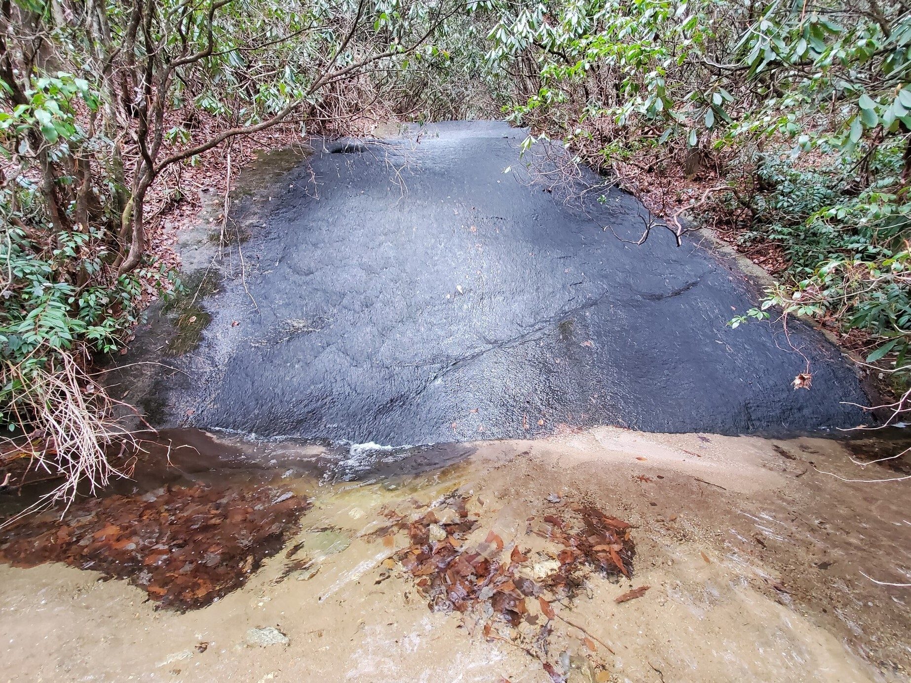 An interesting water feature along the trail.  A sheet of water flowing over a solid rock face into a clear pool.