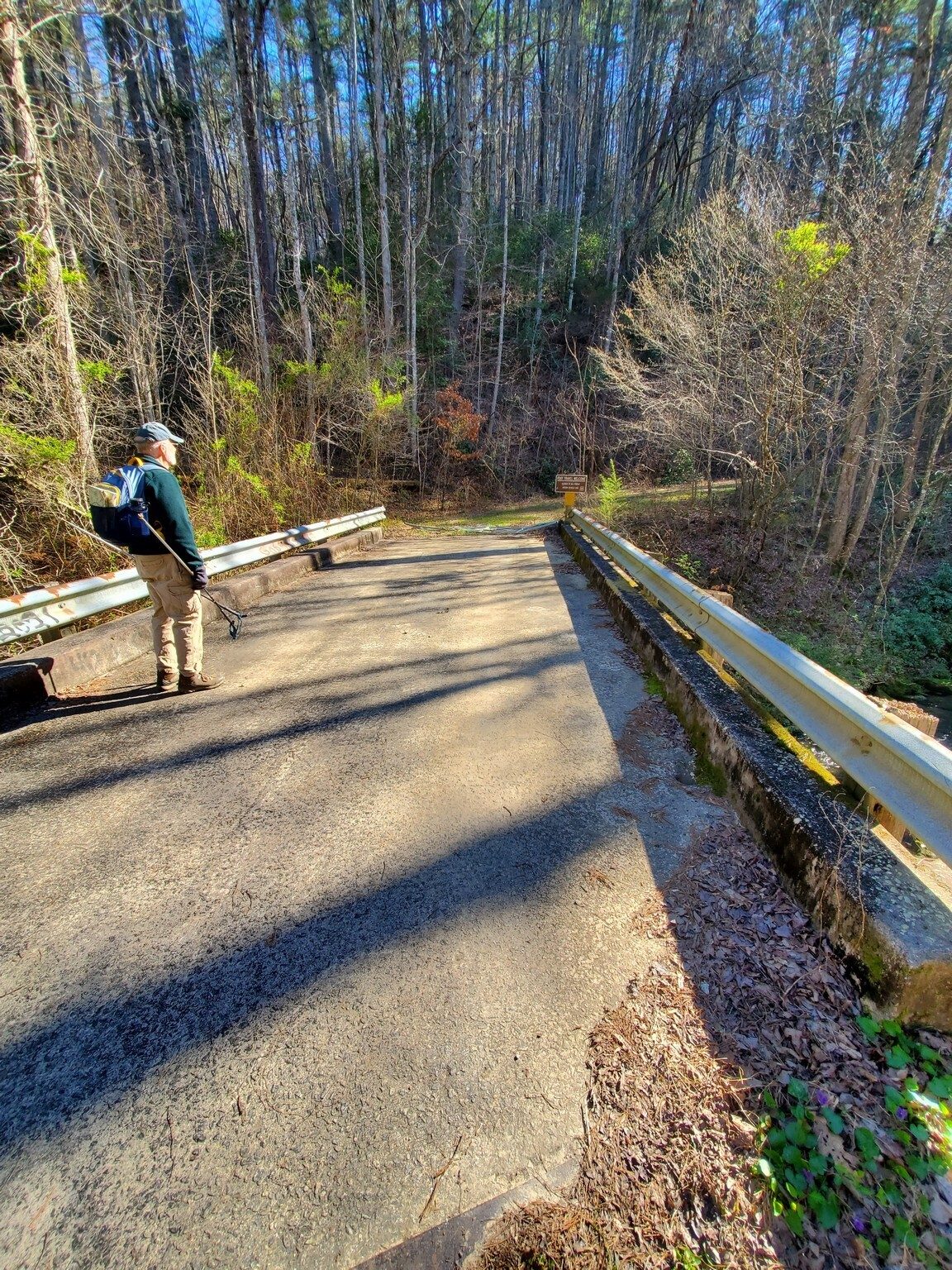 We're scratching our head on this very nice concrete piered and paved bridge across Raper Creek.