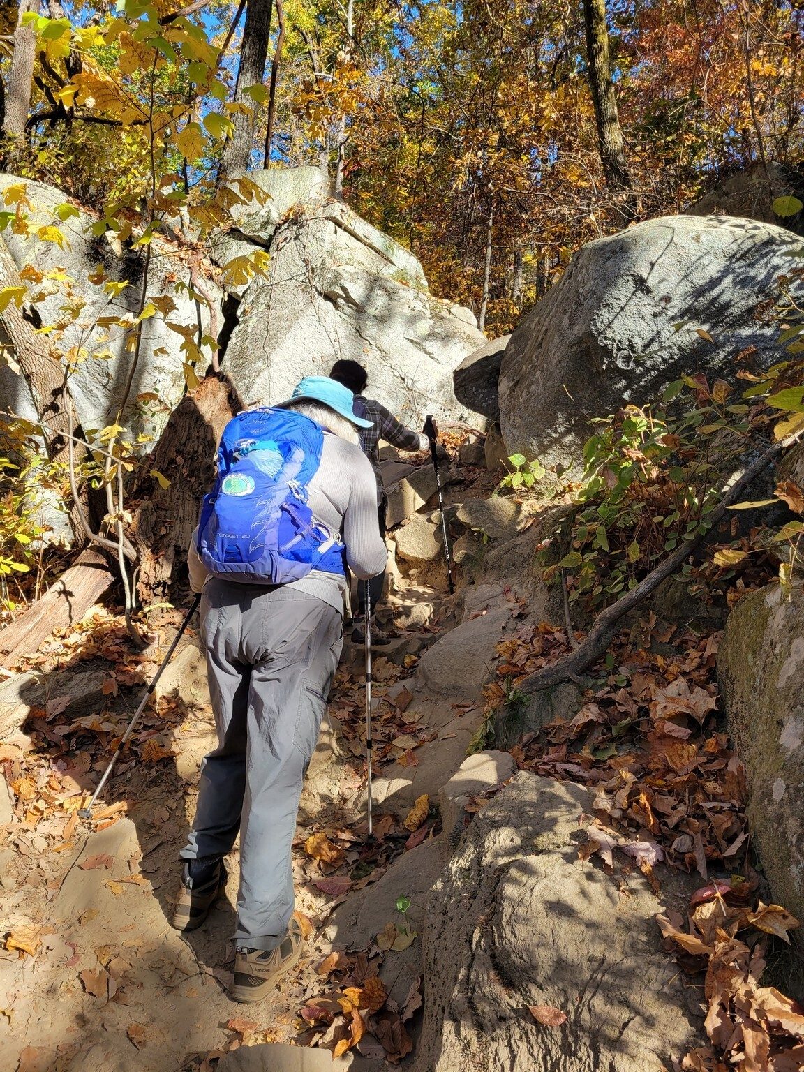 But the trail also has its challenges as Stephanie and Gita find in climbing through this rock outcrop.