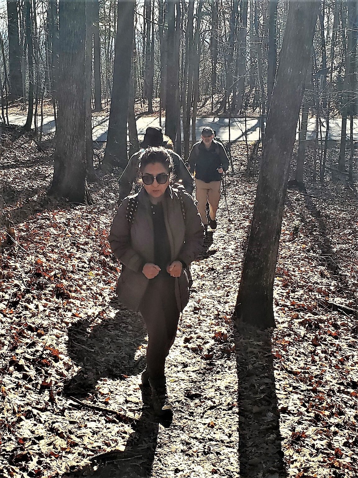 Headed up Grassy Knob with a low sun behind us.