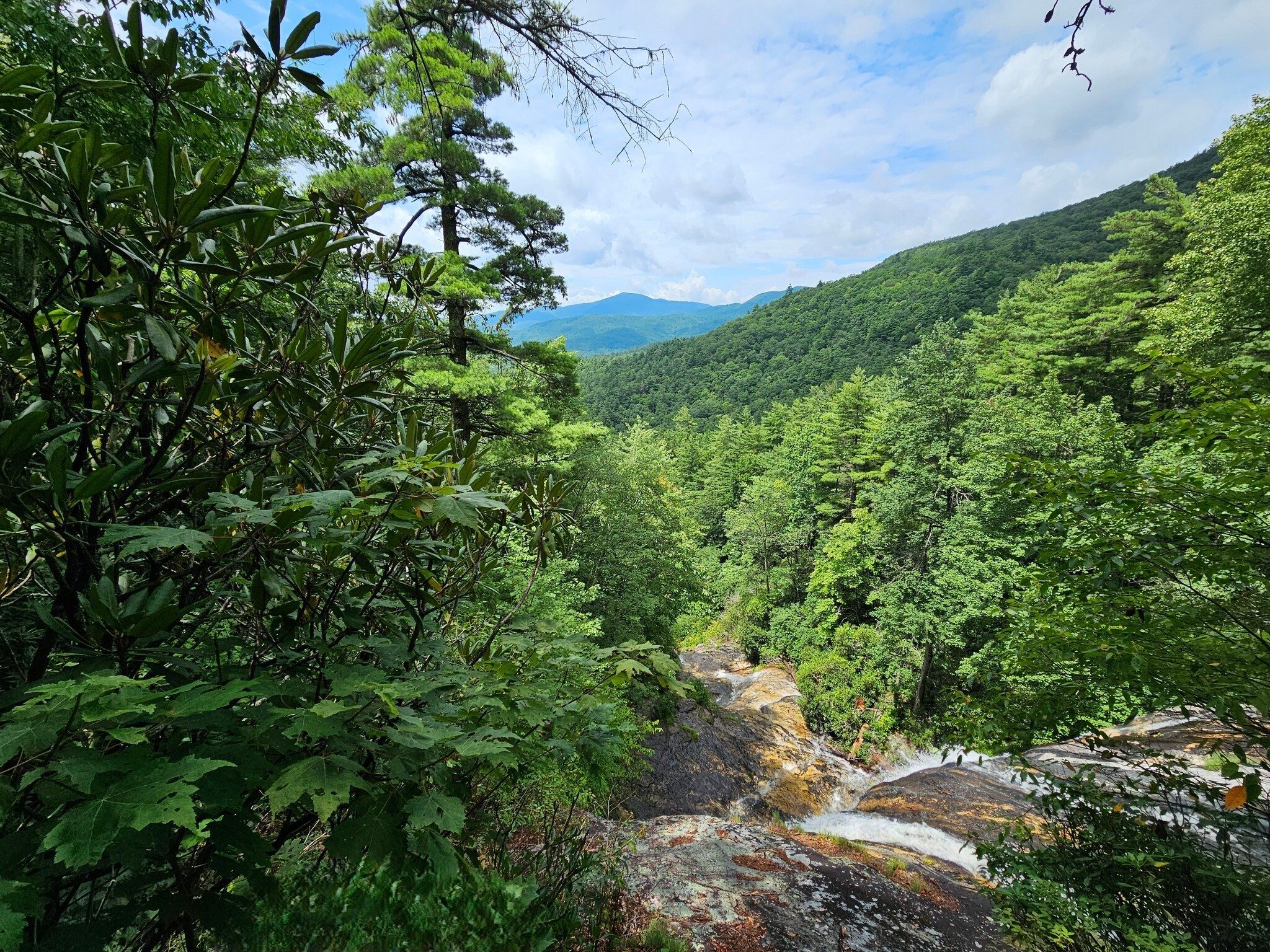 Such a beautiful view from the uppermost falls to the southwest and Rabun Bald in the background. Chinquapin Mtn. to the right..
