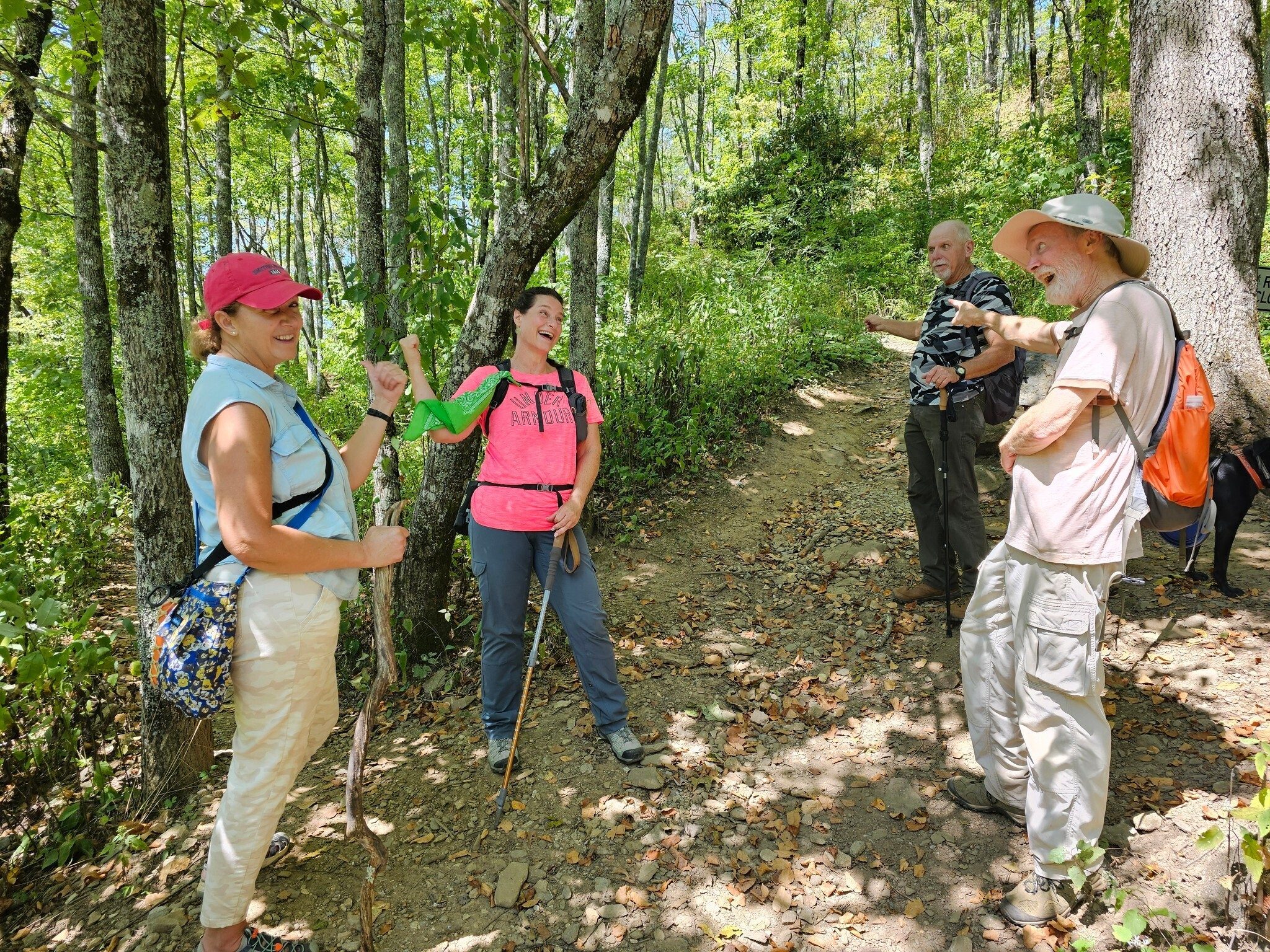 There seems to be a difference of opinion on which way to go, but the ladies are correct.  Unfortunately we took the right-hand trail since the left trail wasn't obvious or blazed.  Oops!