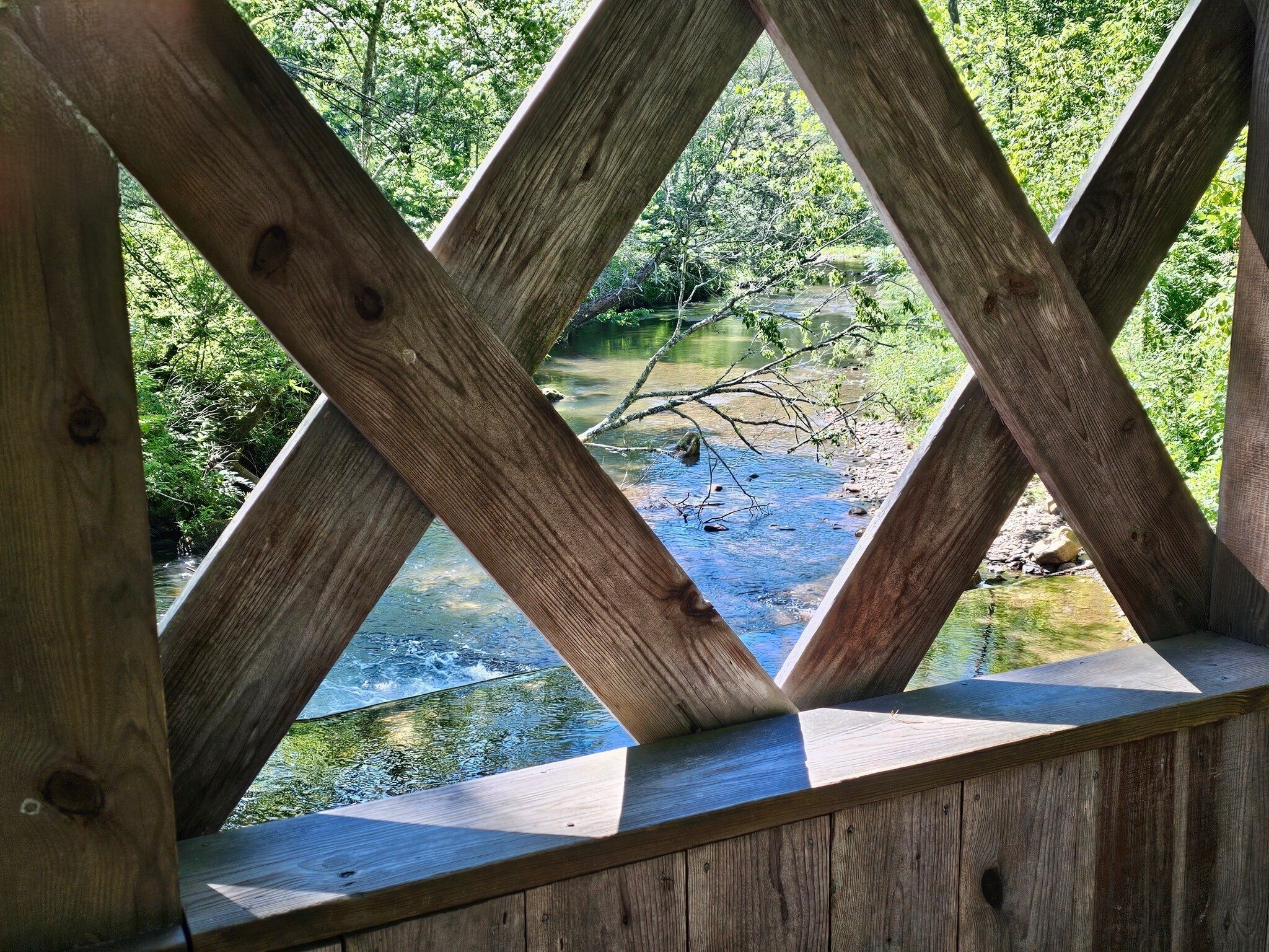 A view of Dukes Creek from inside the covered bridge.