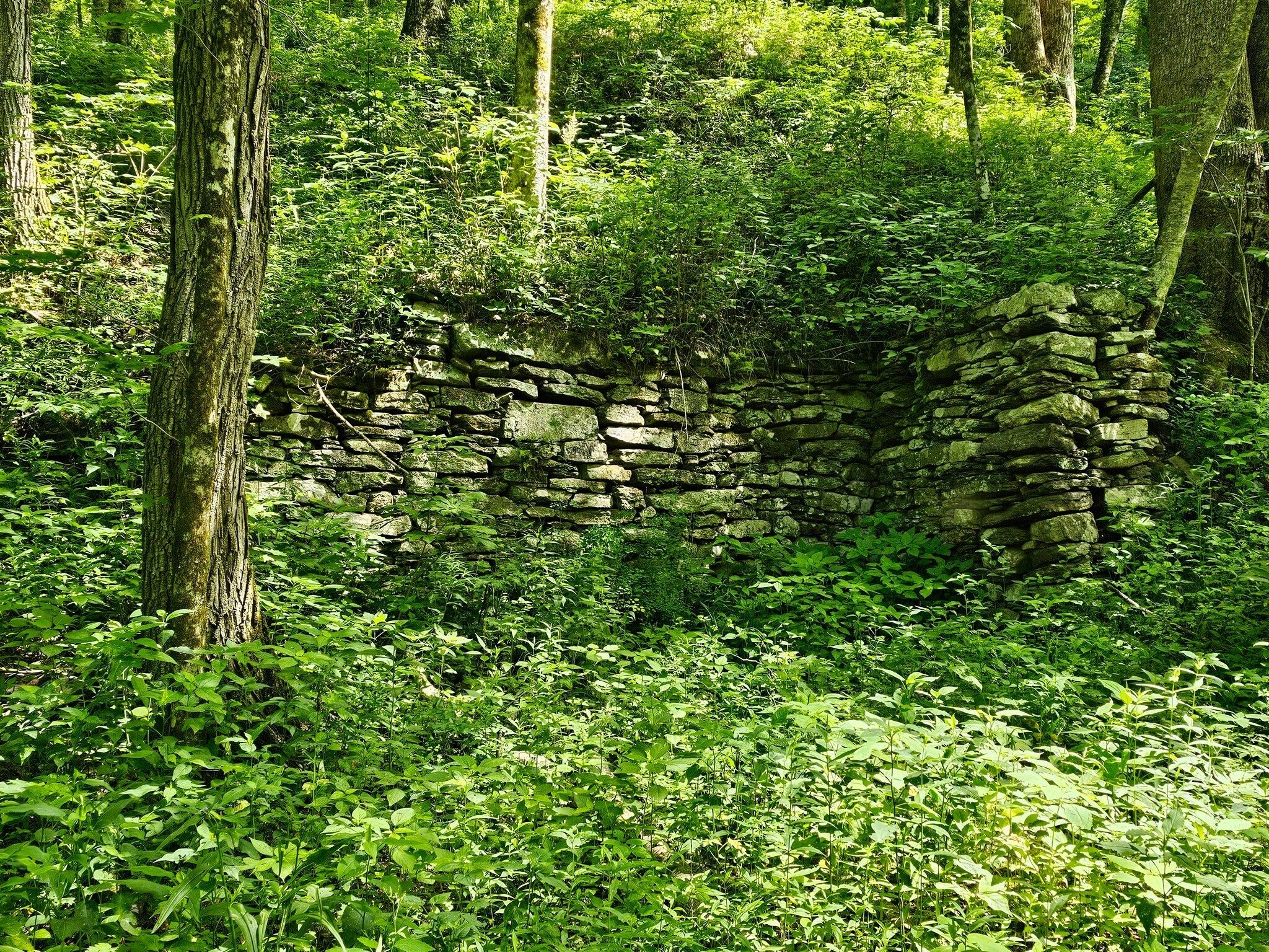 Tony Presley identified this structure as the, "corundum mine loading area."  The cliffs above this area are known for bear to "raise and den" their young.  Eh Heather?