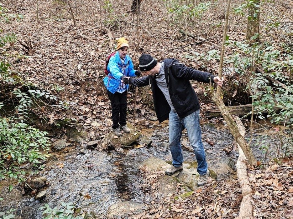 Scott helping Jenny (Mom) across one of the two shallow wet crossings.