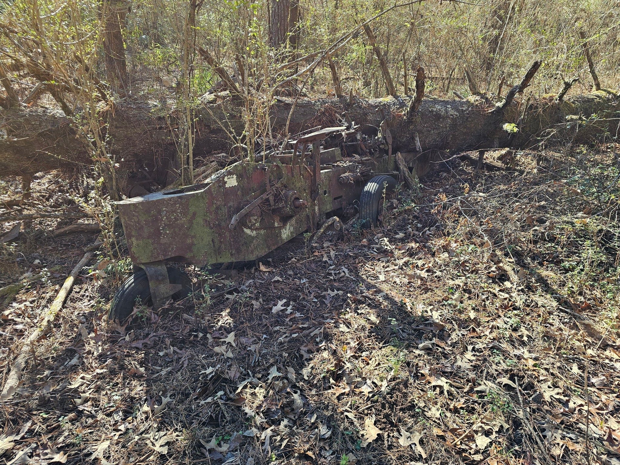 Yep, that farm implement is still there, but then, it's not going anywhere from under that tree.