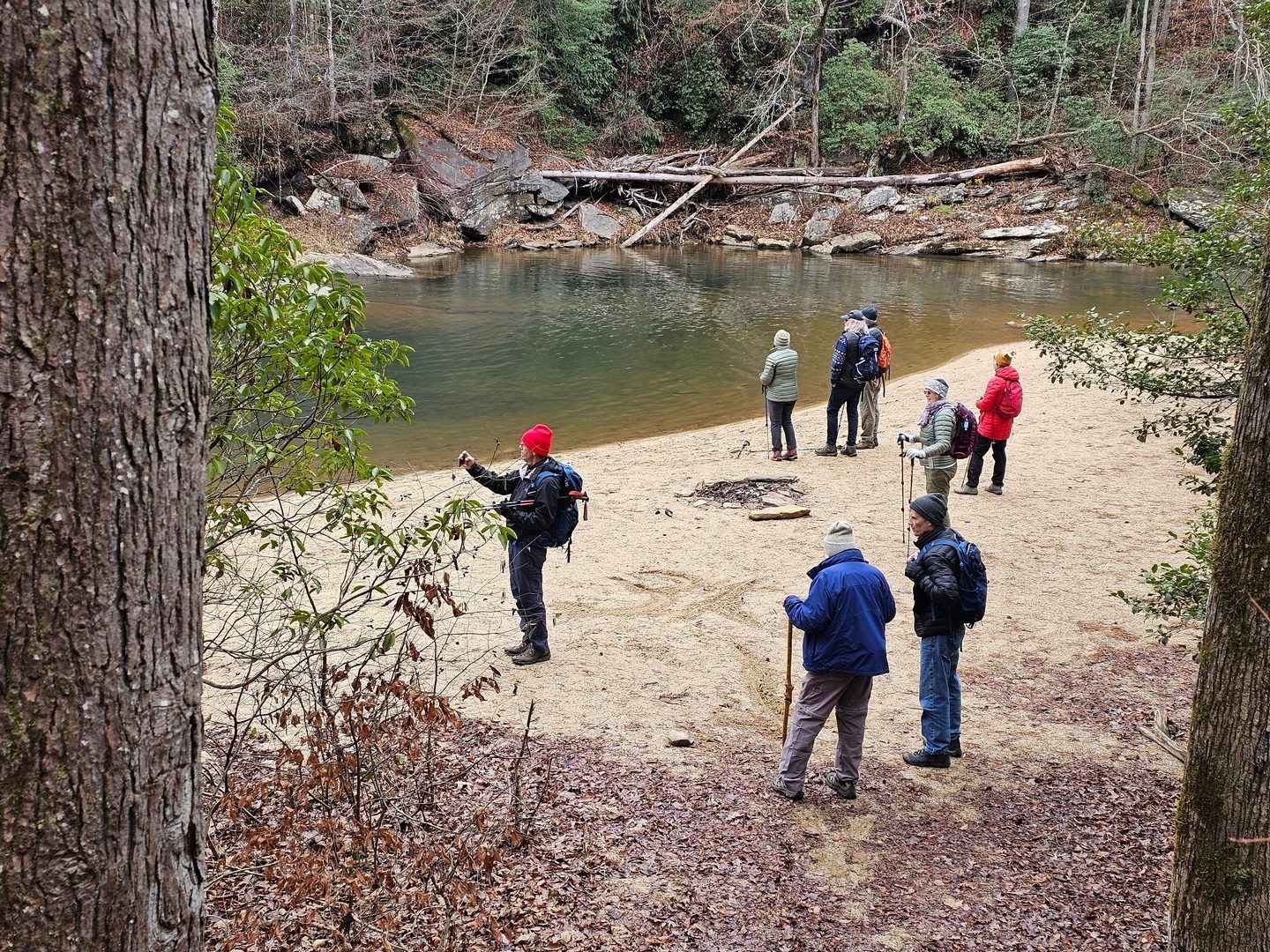 Checking out the falls from the large beach and adjacent swimming hole.