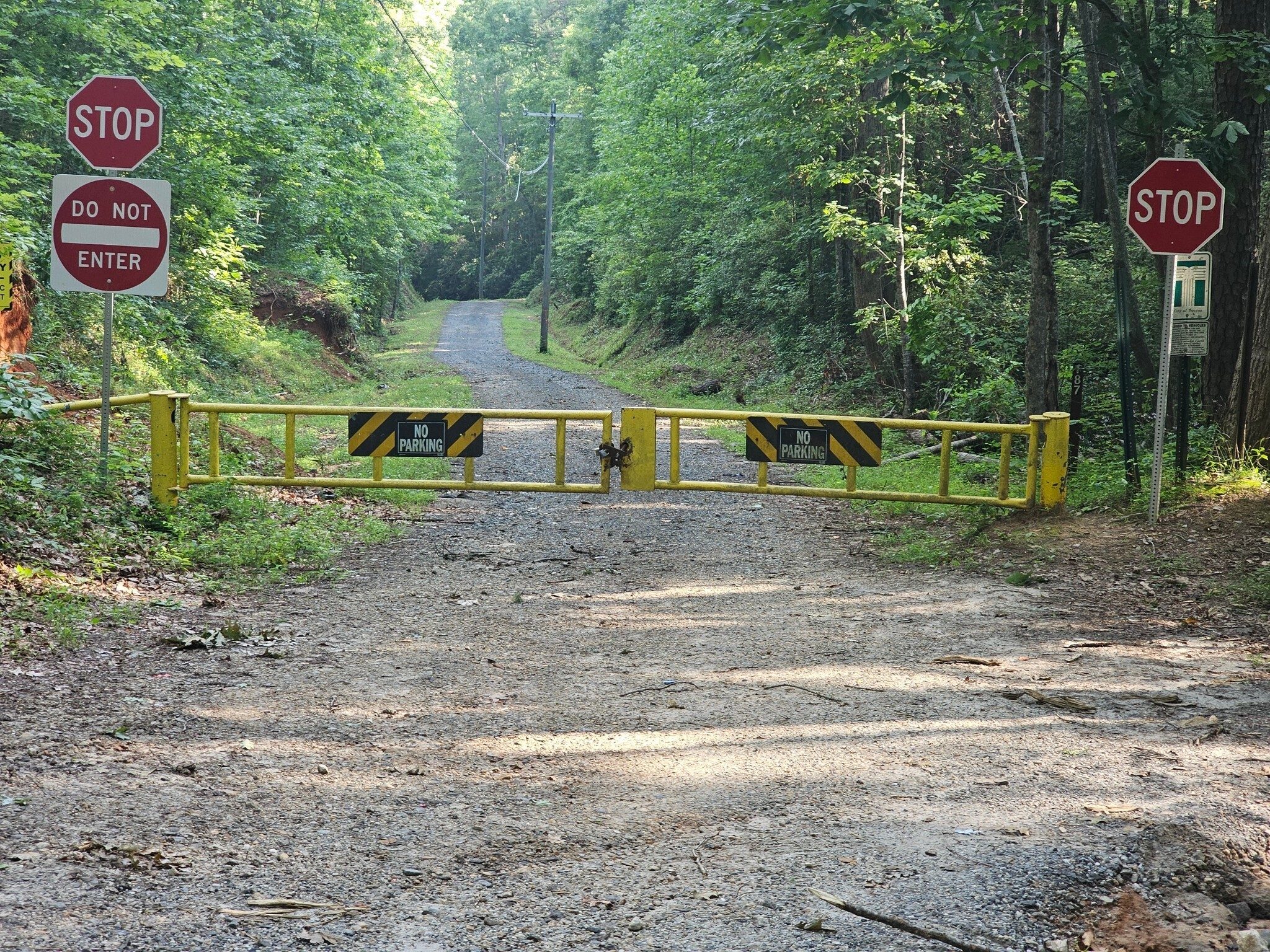The gate at the entrance and the road we walked for the first mile which led us to finding two falls along the way.