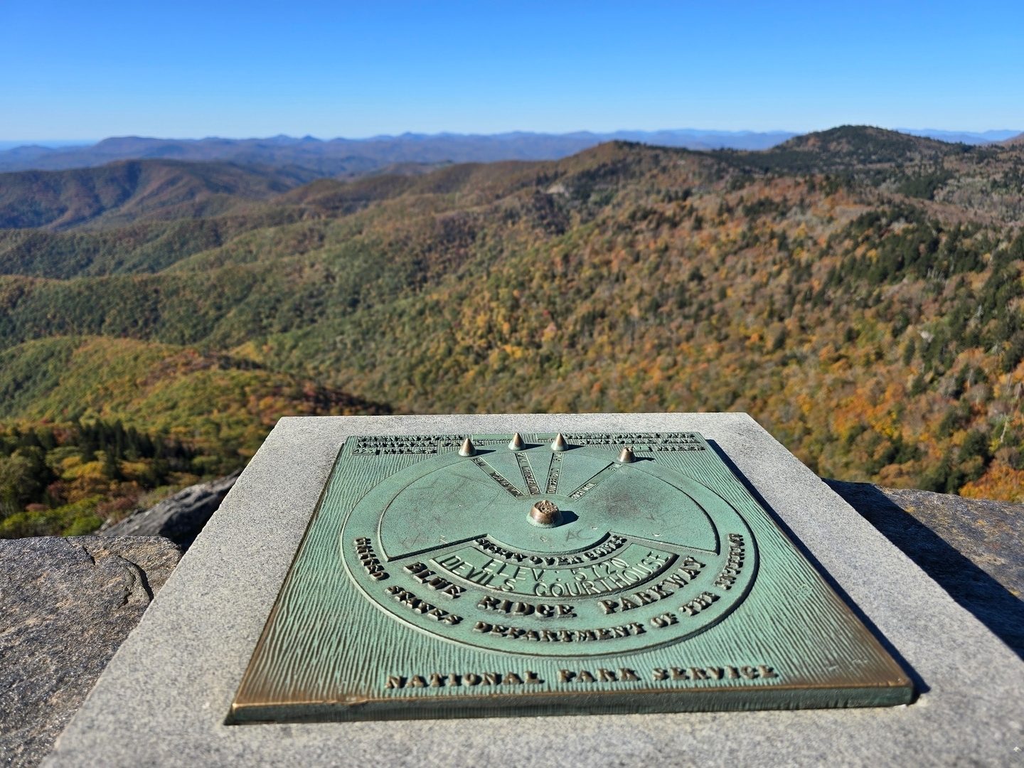 A neat directional marker, identifying the surrounding mountains and landmarks visible from the overlook"  including Rabun Bald, 33 miles to the southwest.  Photo by Jane Voss.