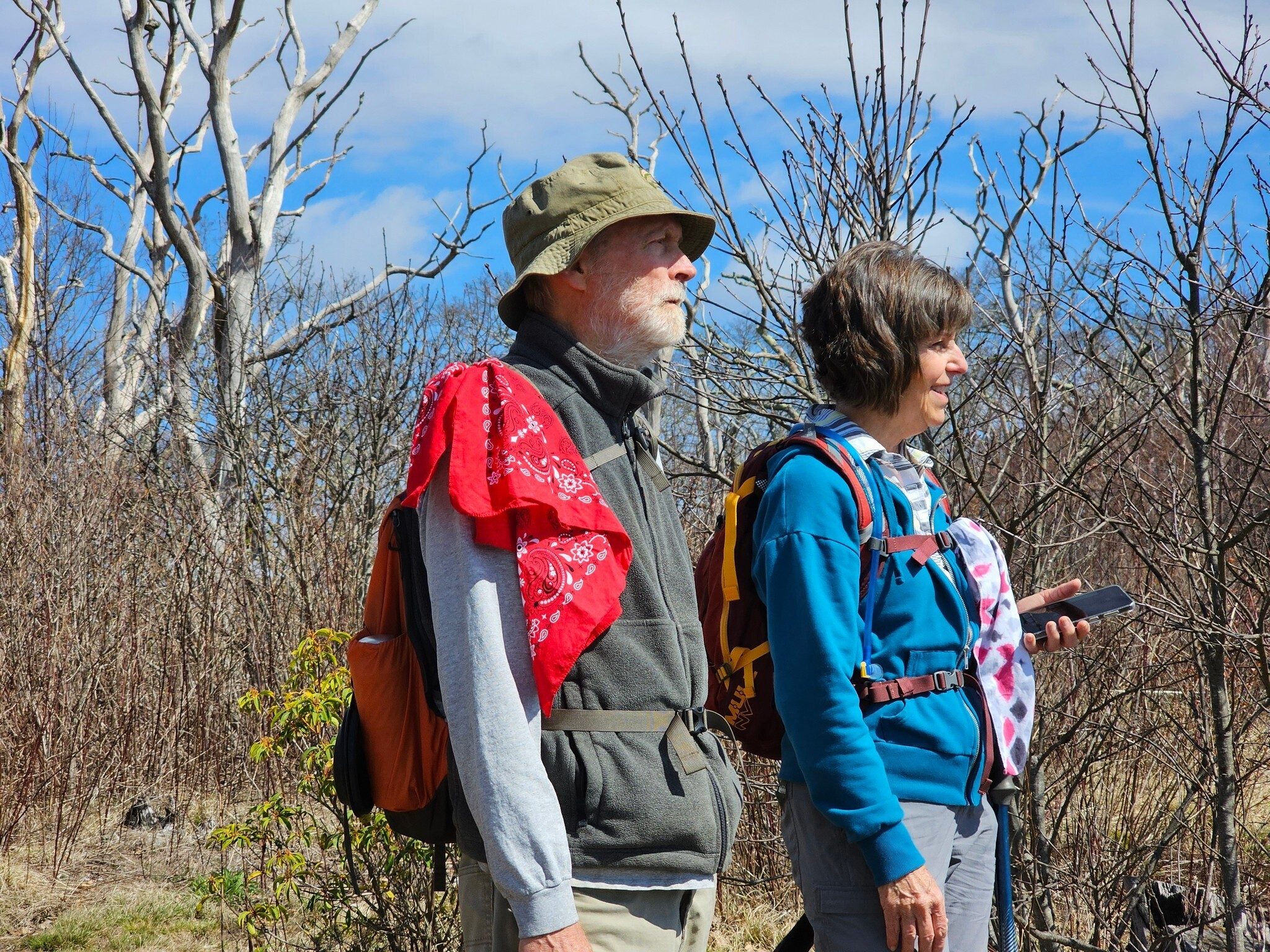 Matt and Beth are taking in the initial views of mountains and valleys to the southeast just prior to reaching the peak of Wayah Bald.