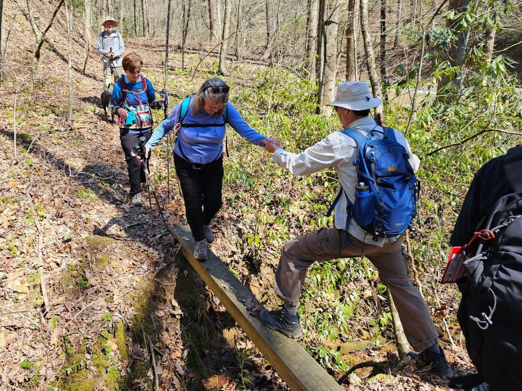 Gerald is alway quite helpful to our lady hikers like this narrow "single-board" bridge at the end of the trail.