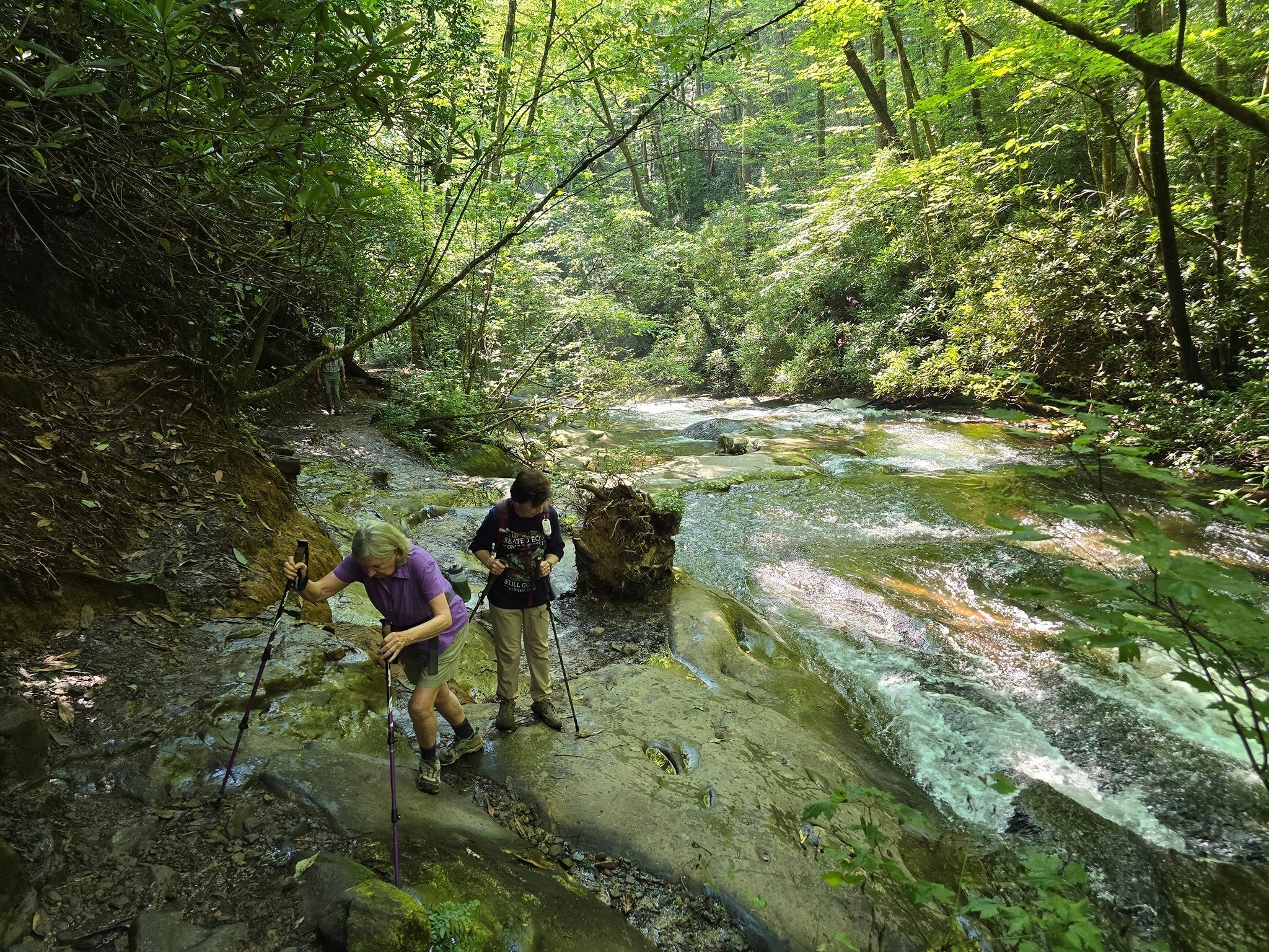 Angela and Jenny being cautious in climbing up these rocks to continue on. Photo by Jane Voss