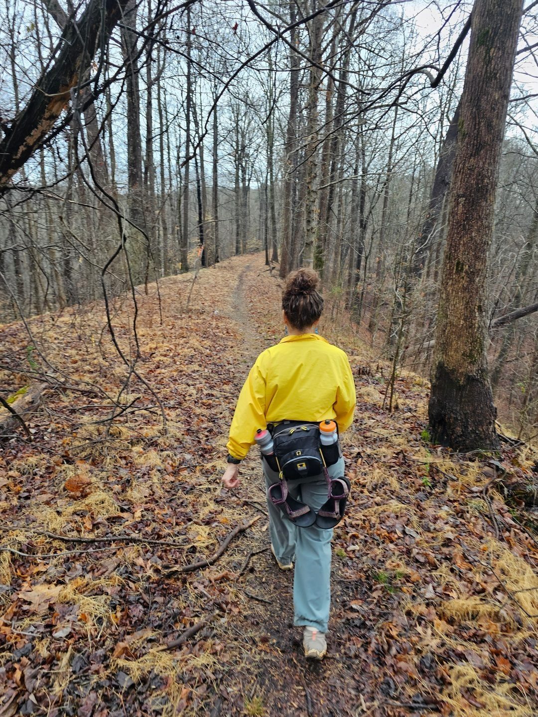 Heather leads the way down the constructed railroad bed high above the river and rock culvert we are to see.