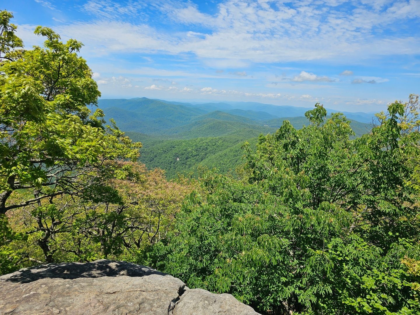A bit of a hazy view to the southwest from the large boulder outcrop.