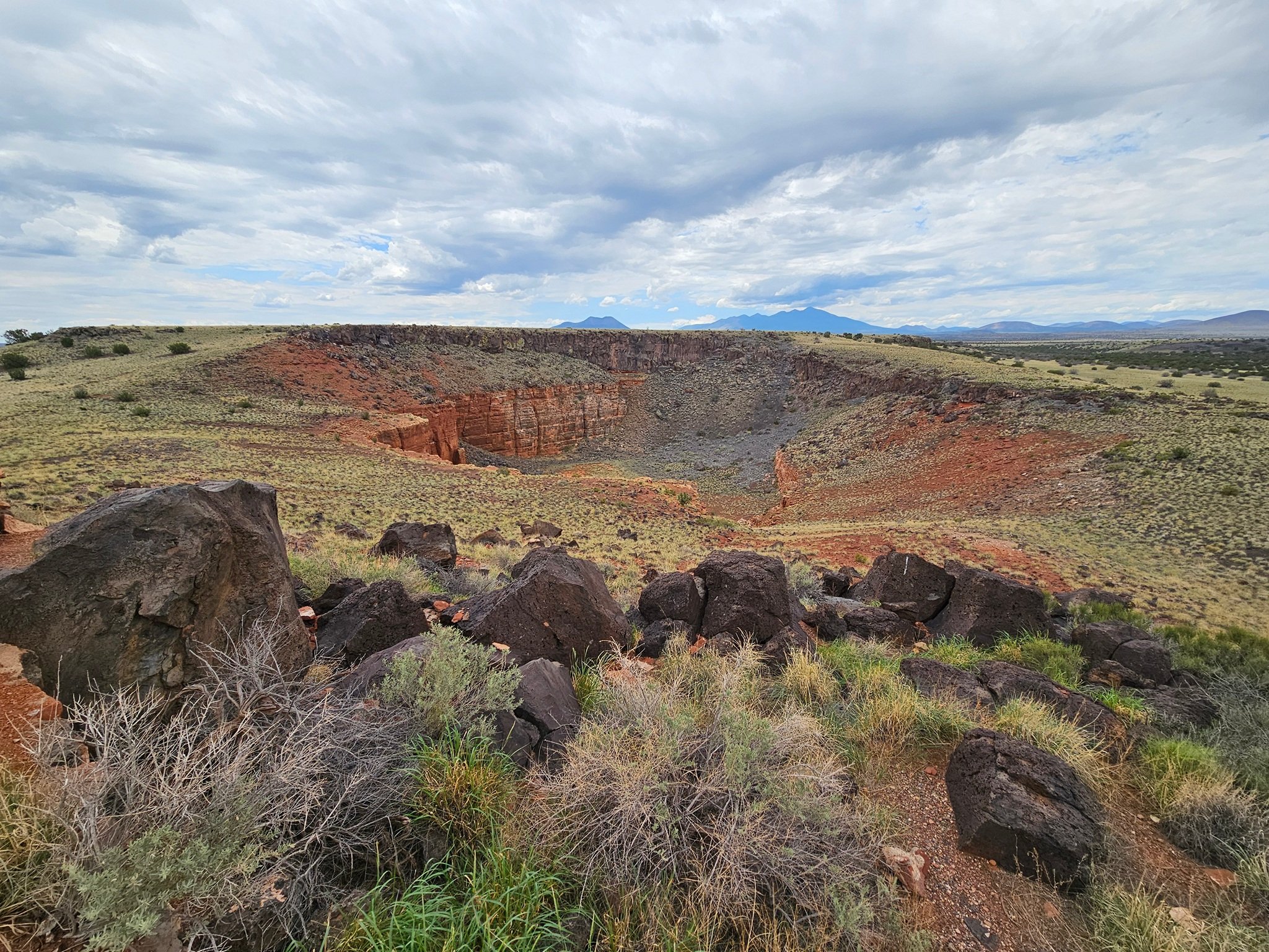 The sinkhole from where much of the stone was gathered for building these pueblos.
