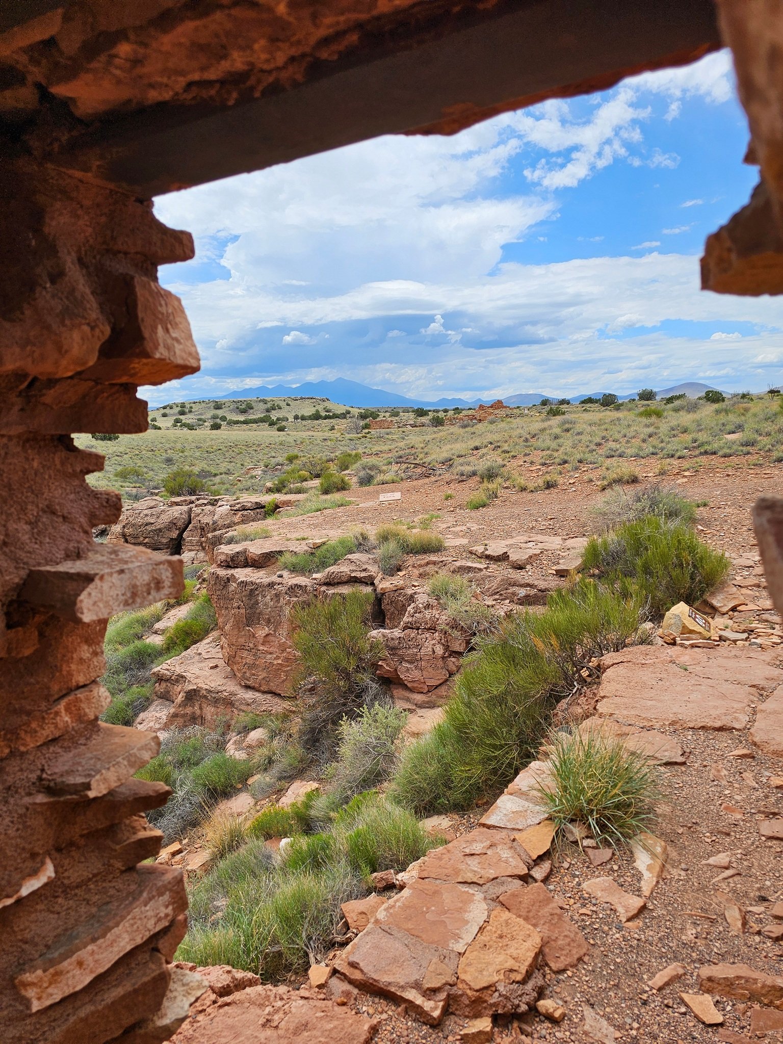 Looking through a window of the Lomaki pueblo with a view of Humphreys Peak to the southwest.
