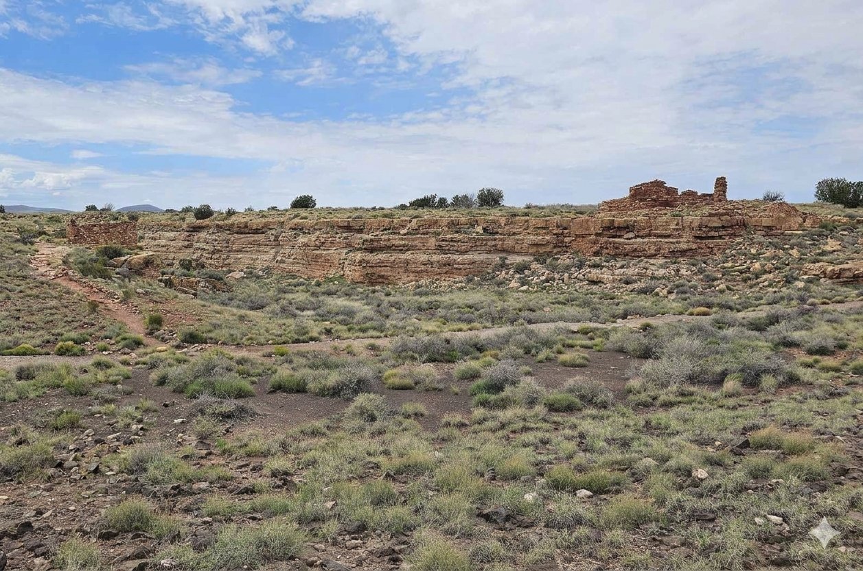 Looking north across the grasslands toward the box canyon at the two pueblos, one on each side of Box Canyon.